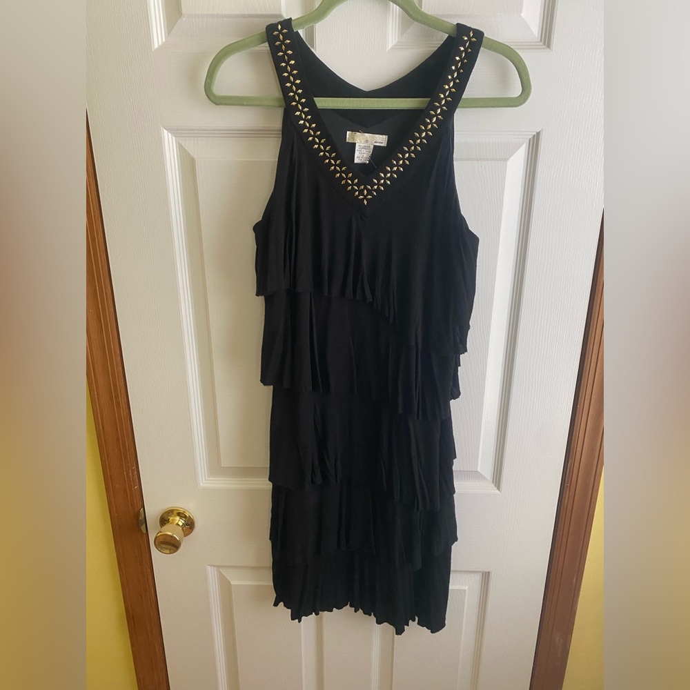 Black dress with gold embellishment around the v-neck
